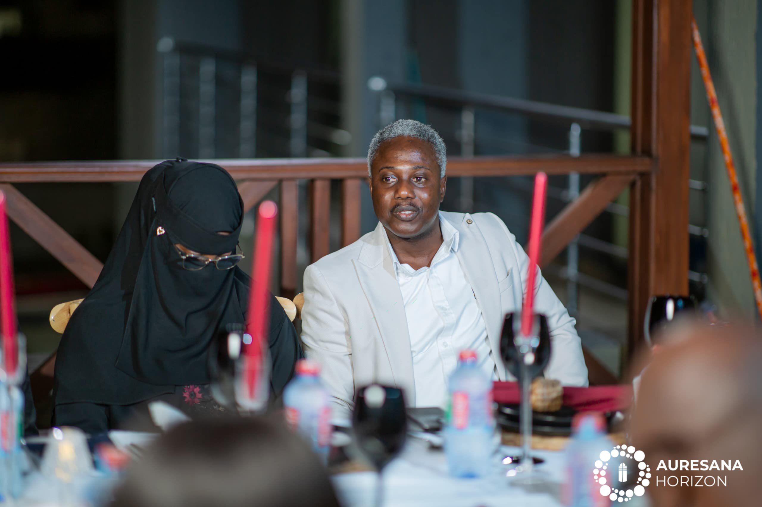 Hawa and Ocran listening attentively.